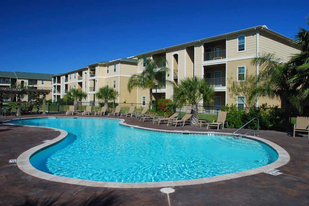 Apartment building with large round pool