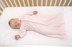 Baby on back in sleep sack